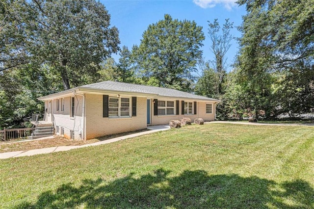 ranch-style home with a front yard