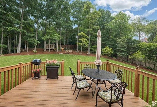 wooden deck with a yard