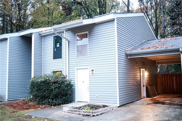 exterior space with a carport