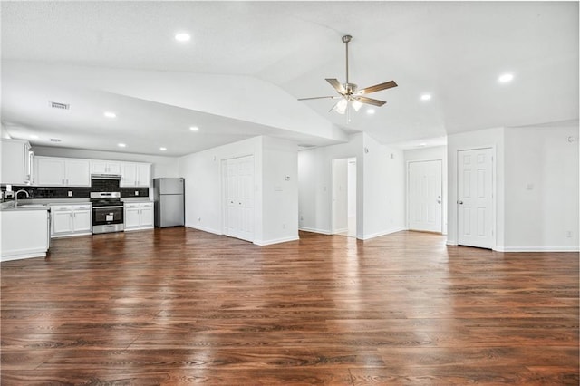 unfurnished living room featuring vaulted ceiling, sink, dark wood-type flooring, and ceiling fan