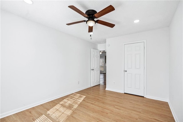 unfurnished bedroom featuring ceiling fan and light hardwood / wood-style flooring