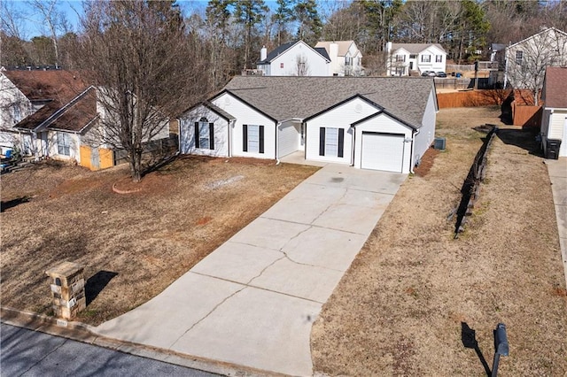 view of front of house featuring a garage and a front yard