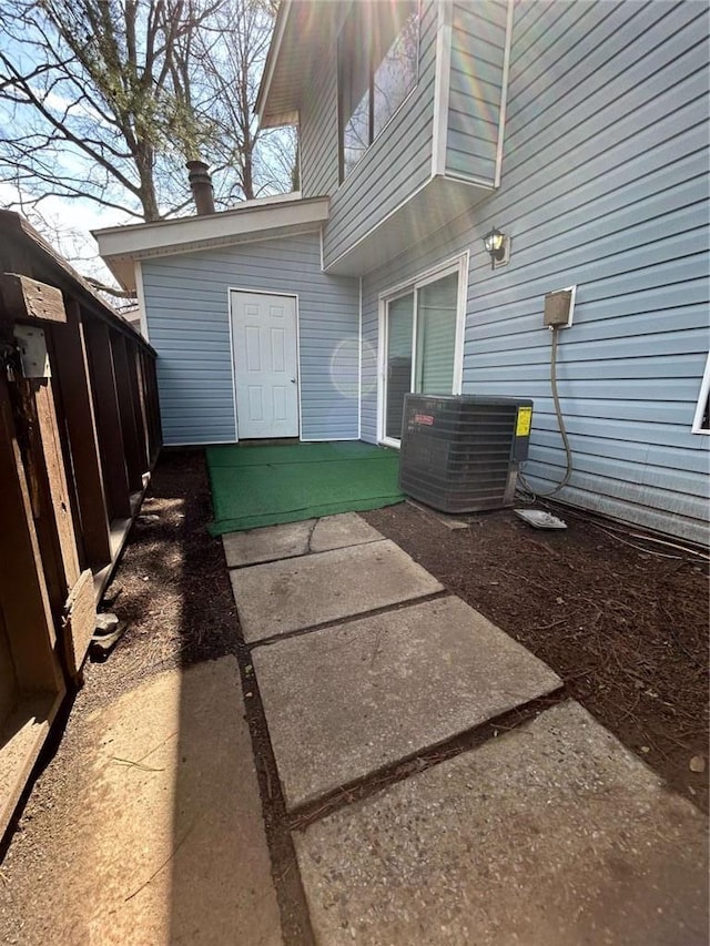 view of patio / terrace featuring central AC and fence