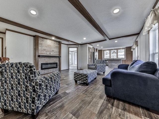 living room with dark hardwood / wood-style floors, beam ceiling, and a textured ceiling