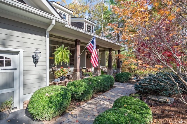 property entrance featuring covered porch