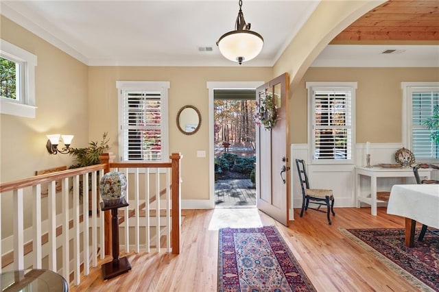 foyer entrance with light hardwood / wood-style floors