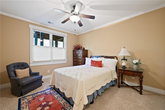 bedroom featuring light colored carpet, ceiling fan, and crown molding