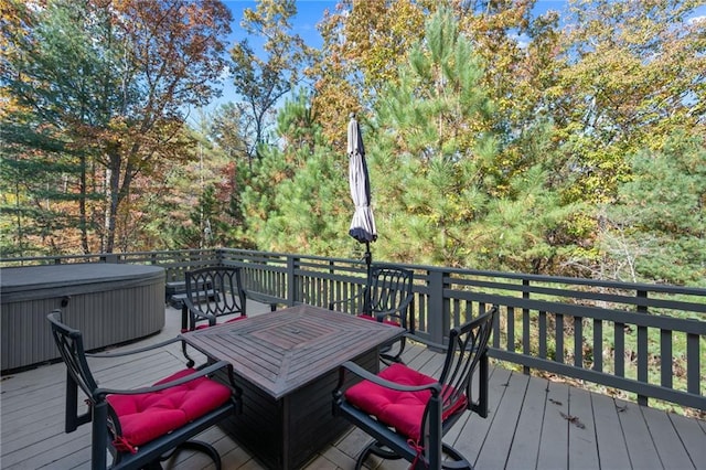 wooden deck featuring a hot tub