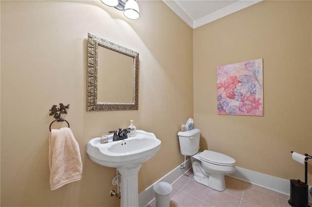 bathroom featuring tile floors and toilet