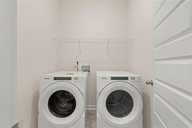 washroom featuring washer and dryer