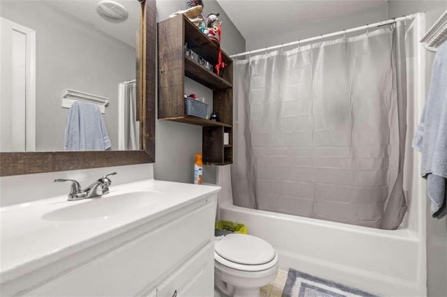 full bathroom with tile patterned floors, vanity, shower / bath combo, and toilet