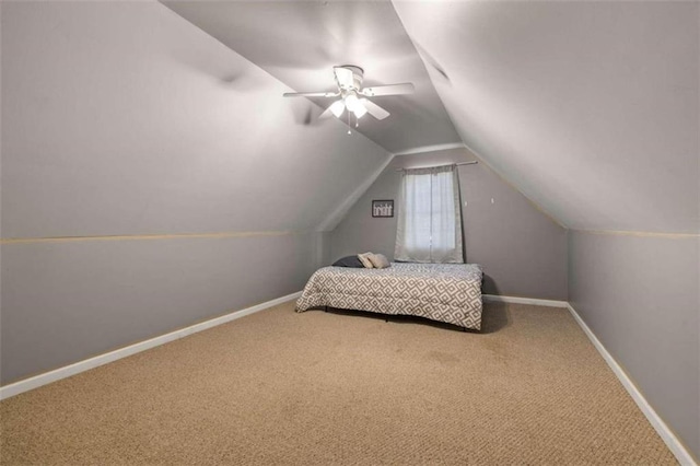 bedroom featuring carpet flooring, ceiling fan, and lofted ceiling