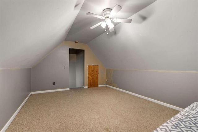 additional living space featuring ceiling fan, carpet floors, and lofted ceiling