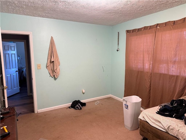 703 Jack Sharp Rd, Colbert, GA 30628 - carpeted bedroom with a textured ceiling and baseboards