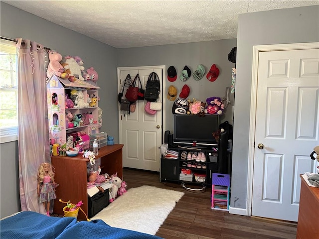 703 Jack Sharp Rd, Colbert, GA 30628 - bedroom with wood finished floors and a textured ceiling