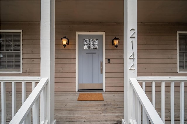 property entrance featuring covered porch