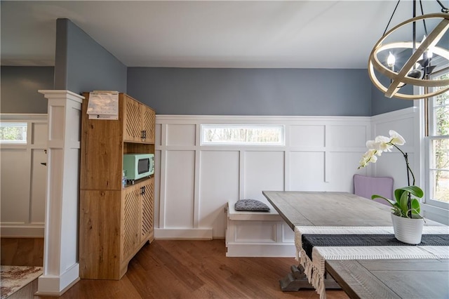 interior space with breakfast area, a healthy amount of sunlight, and light hardwood / wood-style flooring