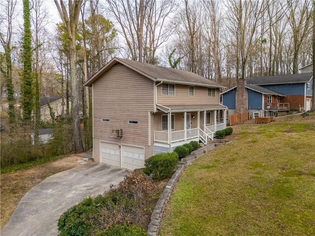 view of front of property with a garage, a porch, and a front lawn