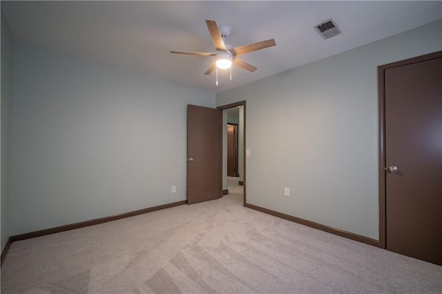 carpeted empty room with ceiling fan