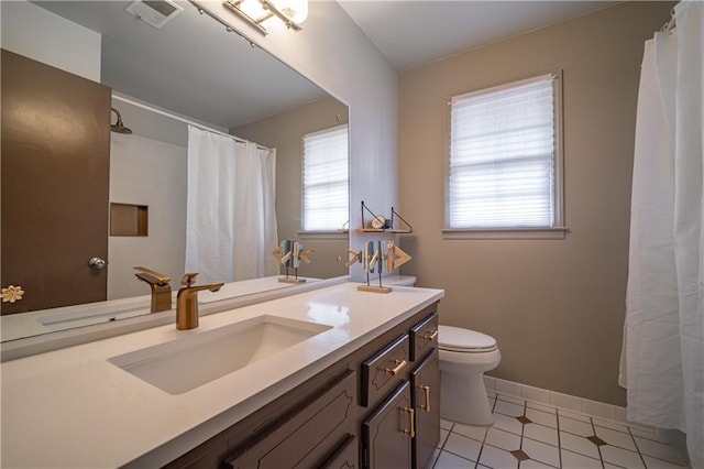 bathroom with tile patterned floors, vanity, toilet, and a shower with shower curtain