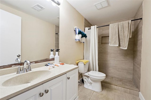 full bathroom with visible vents, vanity, toilet, and tiled shower