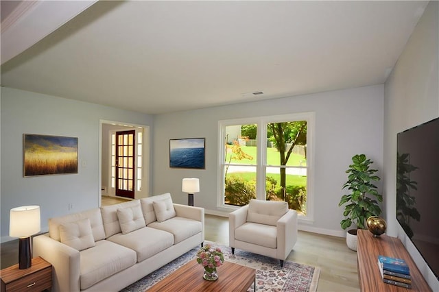9050 Brockham Way, Alpharetta, GA 30022 - living area with light wood-style flooring and baseboards
