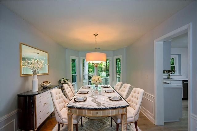 9050 Brockham Way, Alpharetta, GA 30022 - dining area with wood finished floors and a wainscoted wall