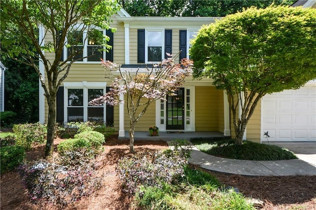 9050 Brockham Way, Alpharetta, GA 30022 - view of front of property with a porch and a garage