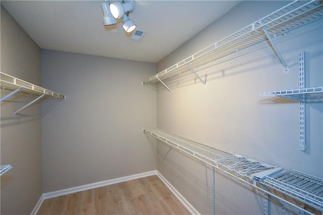 9050 Brockham Way, Alpharetta, GA 30022 - spacious closet featuring wood finished floors