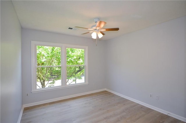 9050 Brockham Way, Alpharetta, GA 30022 - unfurnished room with a ceiling fan, baseboards, and light wood-type flooring
