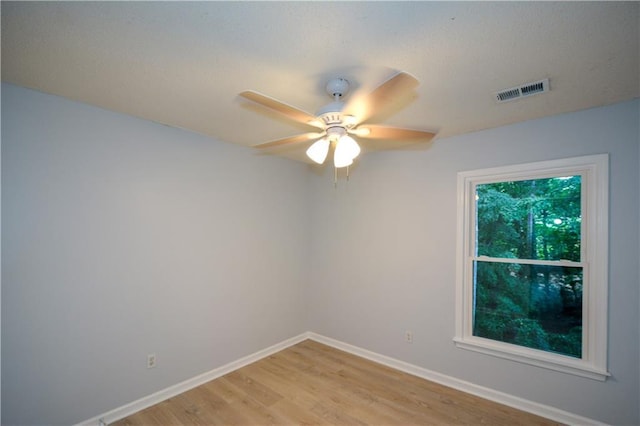 9050 Brockham Way, Alpharetta, GA 30022 - unfurnished room with baseboards, light wood finished floors, and a ceiling fan