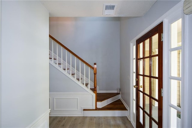 9050 Brockham Way, Alpharetta, GA 30022 - foyer with wood finished floors, stairs, and plenty of natural light