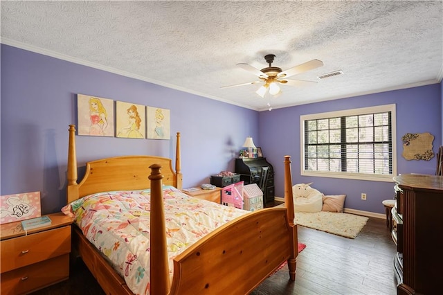 bedroom featuring crown molding, a textured ceiling, dark wood-type flooring, and ceiling fan