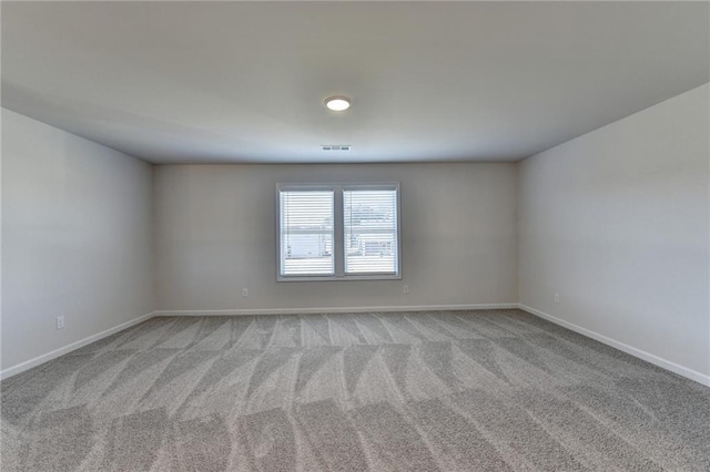 empty room featuring light colored carpet