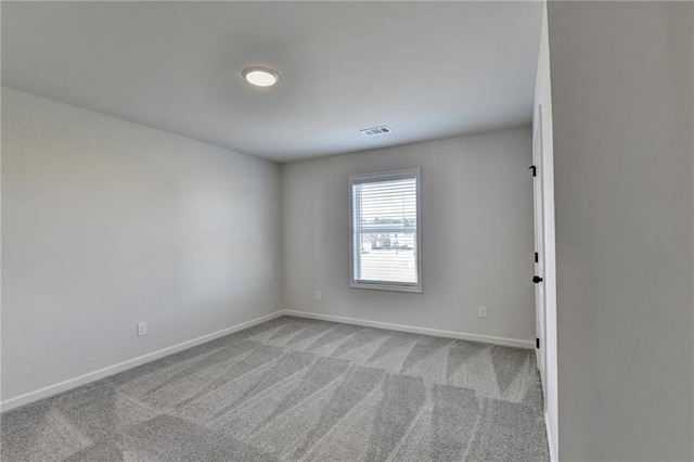 spare room featuring carpet floors