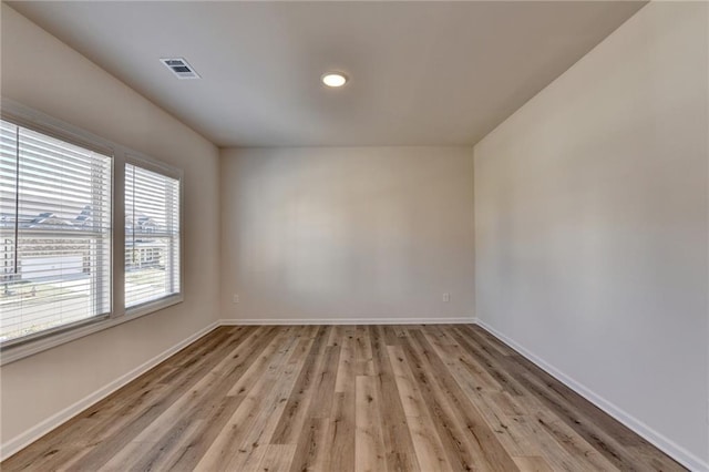 empty room with light wood-type flooring