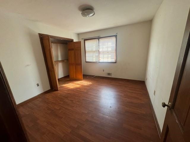 3415 Spring Valley Blvd, Atlanta, GA 30349 - unfurnished bedroom featuring wood finished floors and a closet