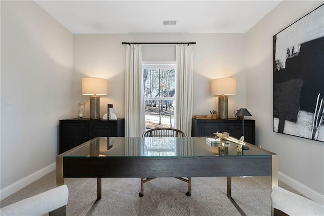 carpeted office space with baseboards