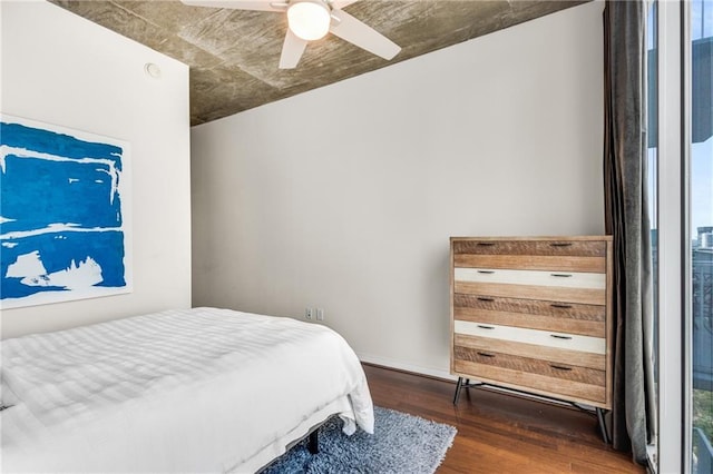 bedroom featuring a ceiling fan and wood finished floors