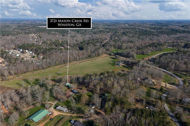 aerial view with a wooded view