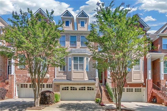 townhome / multi-family property featuring a garage