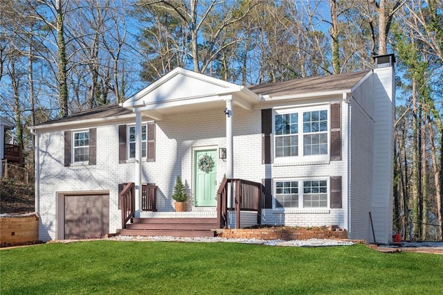 view of front of house featuring a garage and a front yard