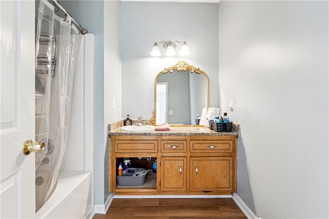 bathroom featuring shower / tub combo, vanity, and hardwood / wood-style flooring