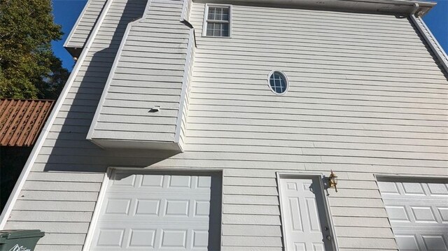 view of side of home with a garage