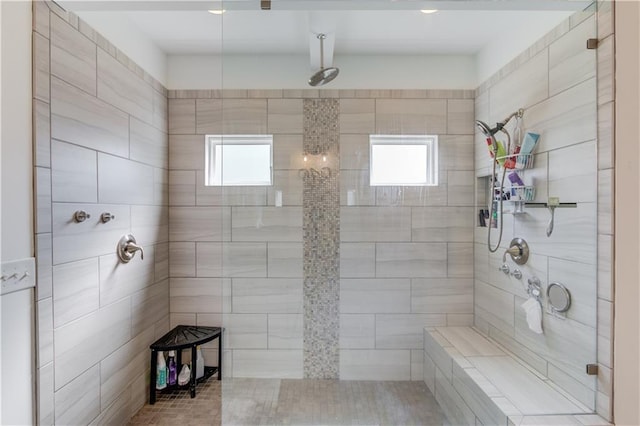 bathroom with tiled shower