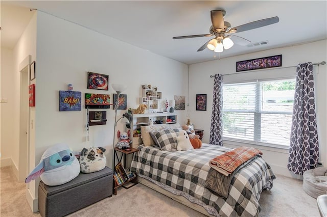 bedroom with light colored carpet and ceiling fan