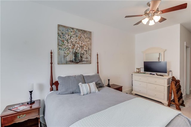 bedroom with ceiling fan and carpet floors