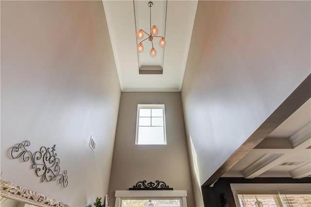 staircase featuring ornamental molding