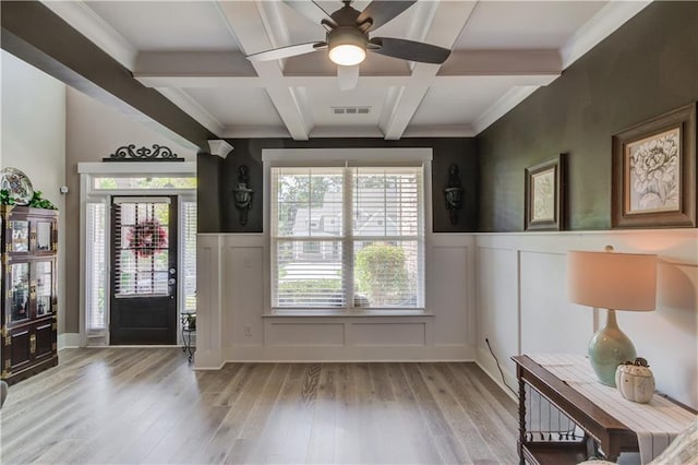 foyer with beamed ceiling, coffered ceiling, ceiling fan, and light hardwood / wood-style flooring