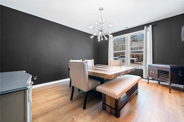 232 Northridge Dr, Dallas, GA 30132 - dining room featuring a chandelier, light wood finished floors, and baseboards
